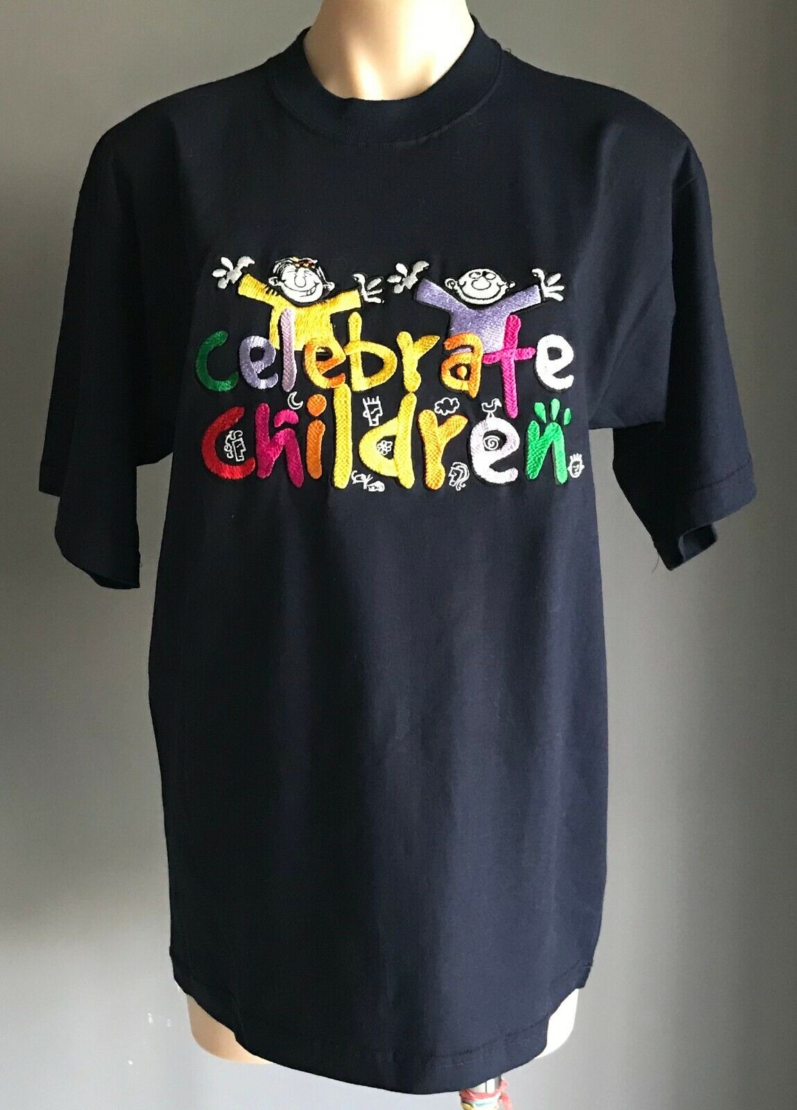 Unisex "Celebrate Children" T-Shirt Embroidered Logo Motif Size L Navy Blue NEW
