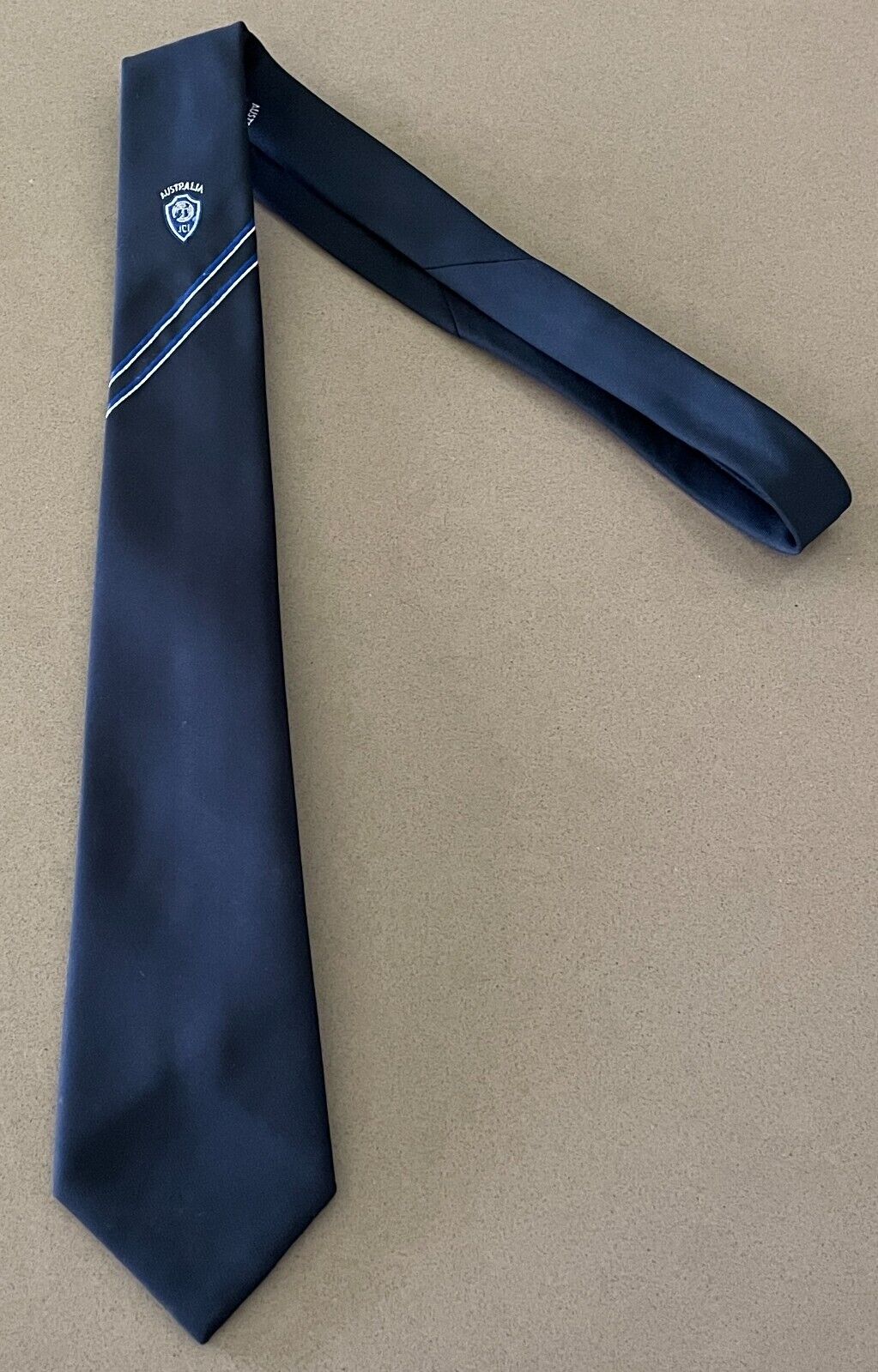 AUSTICO Australia Necktie Junior Chamber International Navy Blue Thin Logo Tie