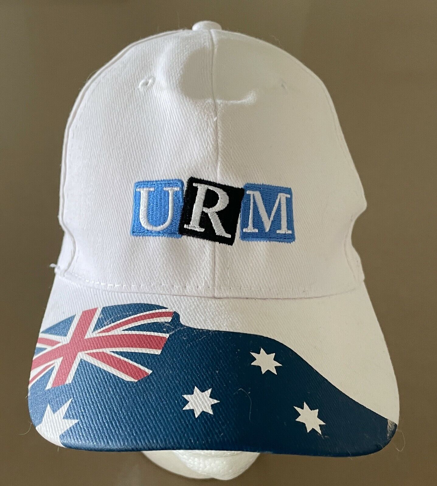 URM Baseball Cap White Adjustable Curved Brim Australian Flag on Visor One Size