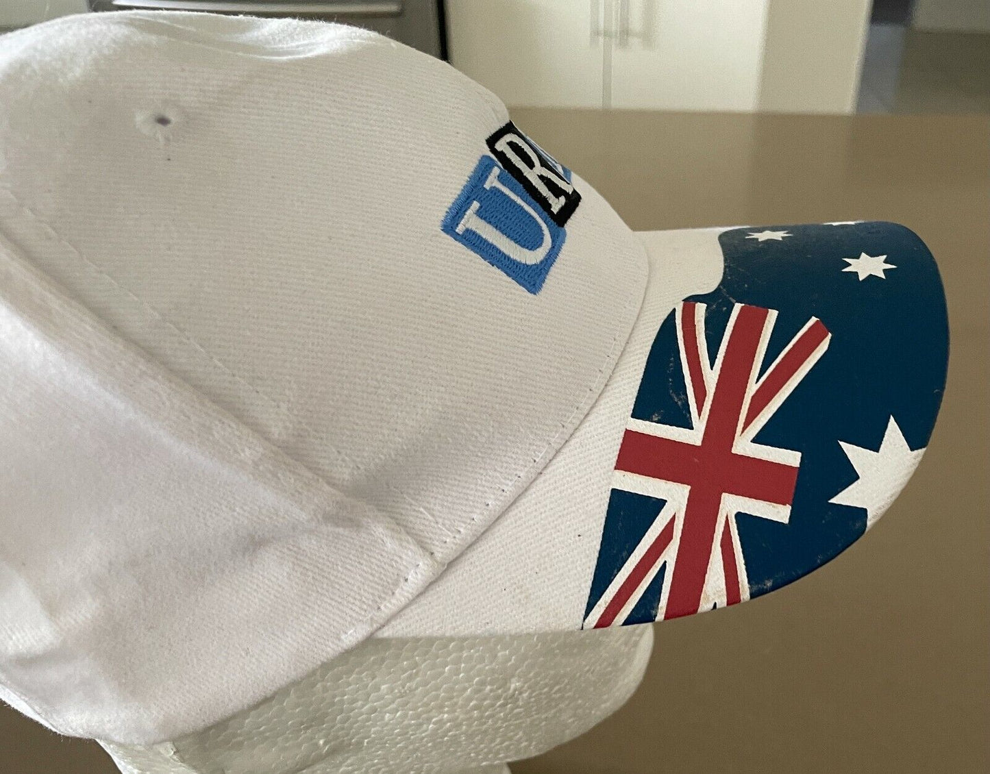 URM Baseball Cap White Adjustable Curved Brim Australian Flag on Visor One Size