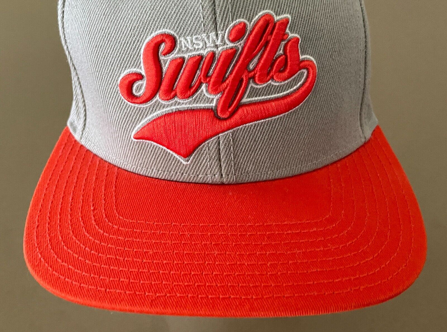 Fan Cap NSW SWIFTS Netball Taupe and Orange Fan Adjustable Flat Bill Hat OSFM